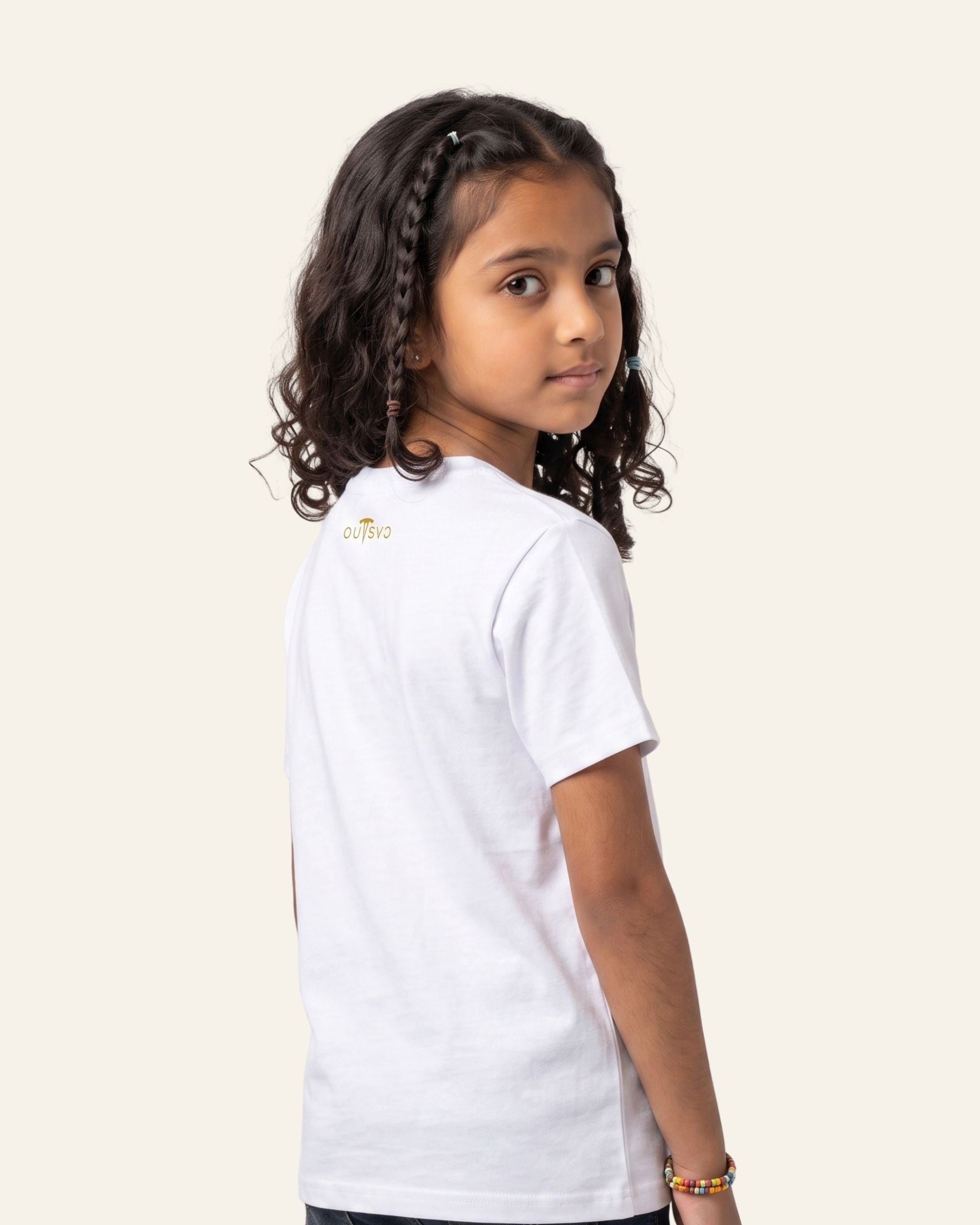 Girl wearing a white OUTCAST basic tee, side view