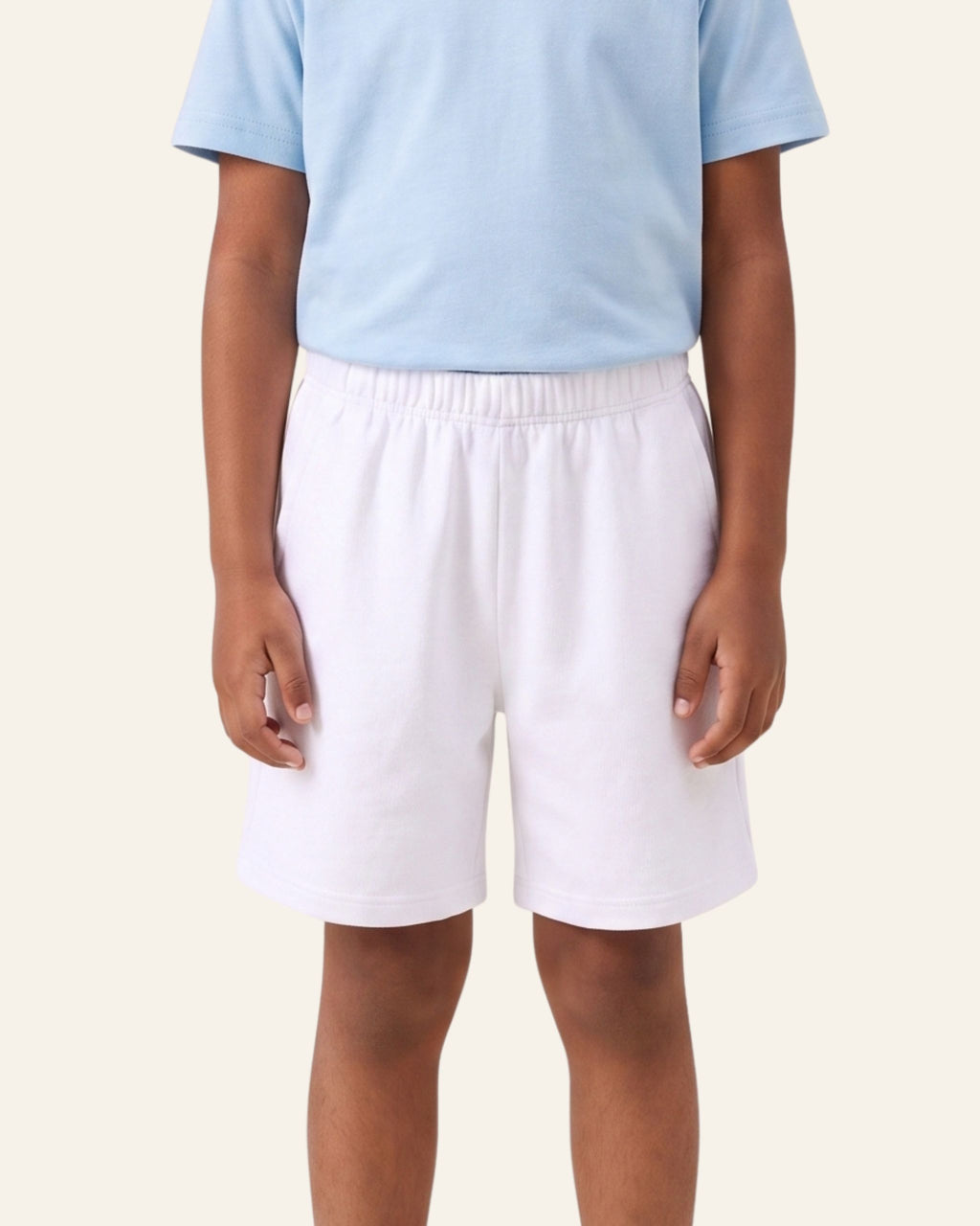 Boy wearing white OUTCAST kids shorts