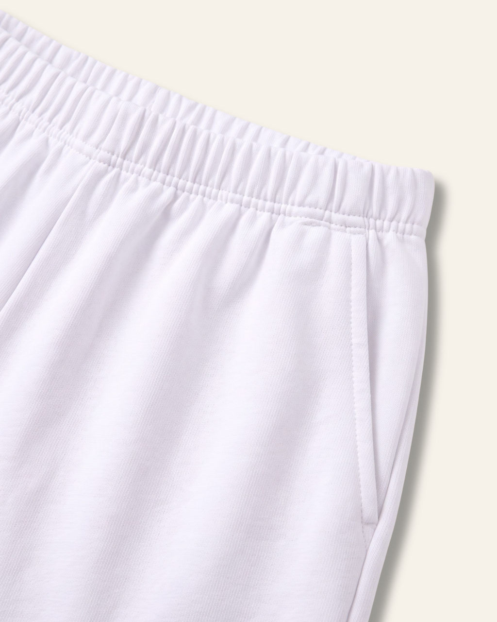 Close-up of the elastic waistband on white kids shorts