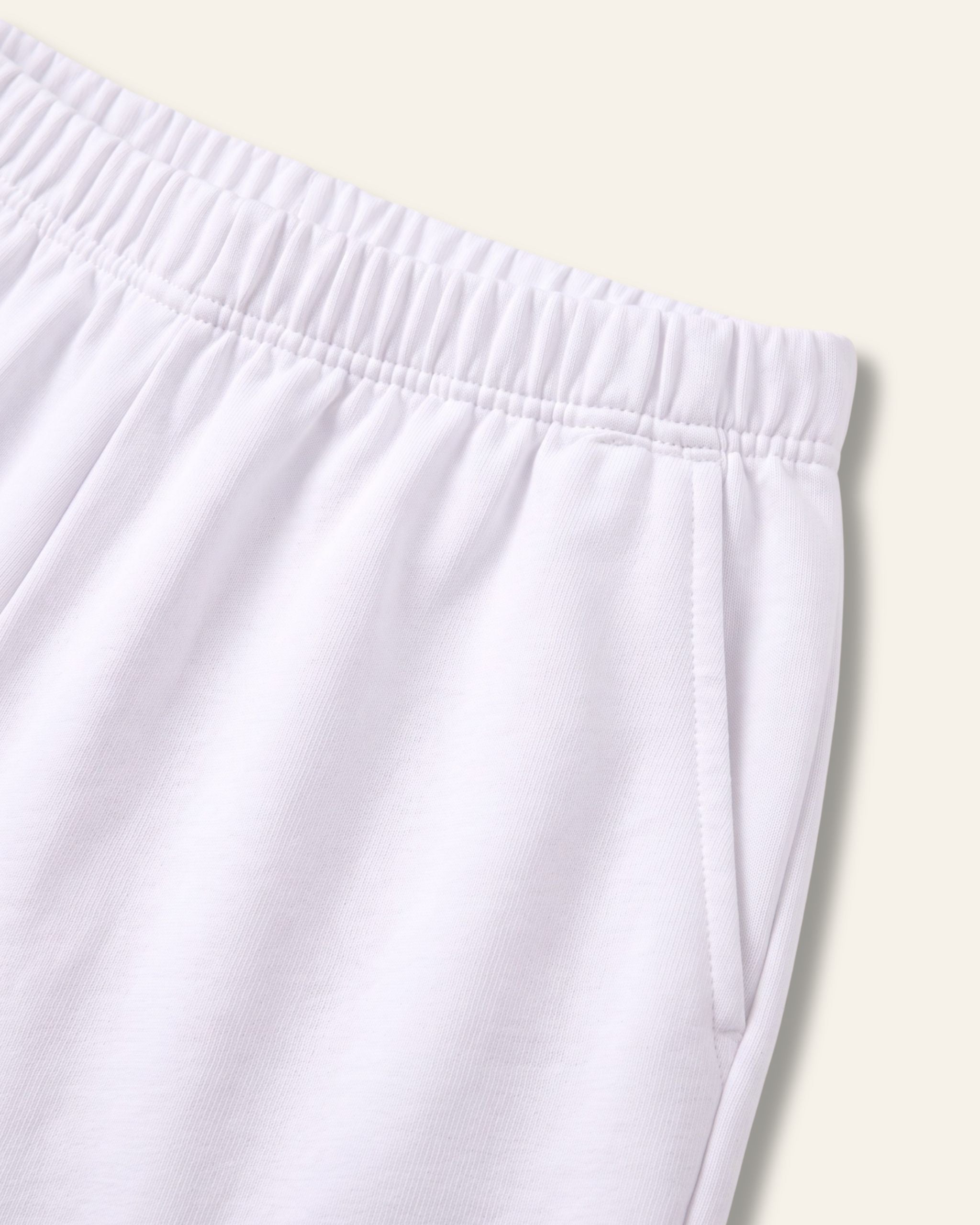 Close-up of the elastic waistband on white kids shorts