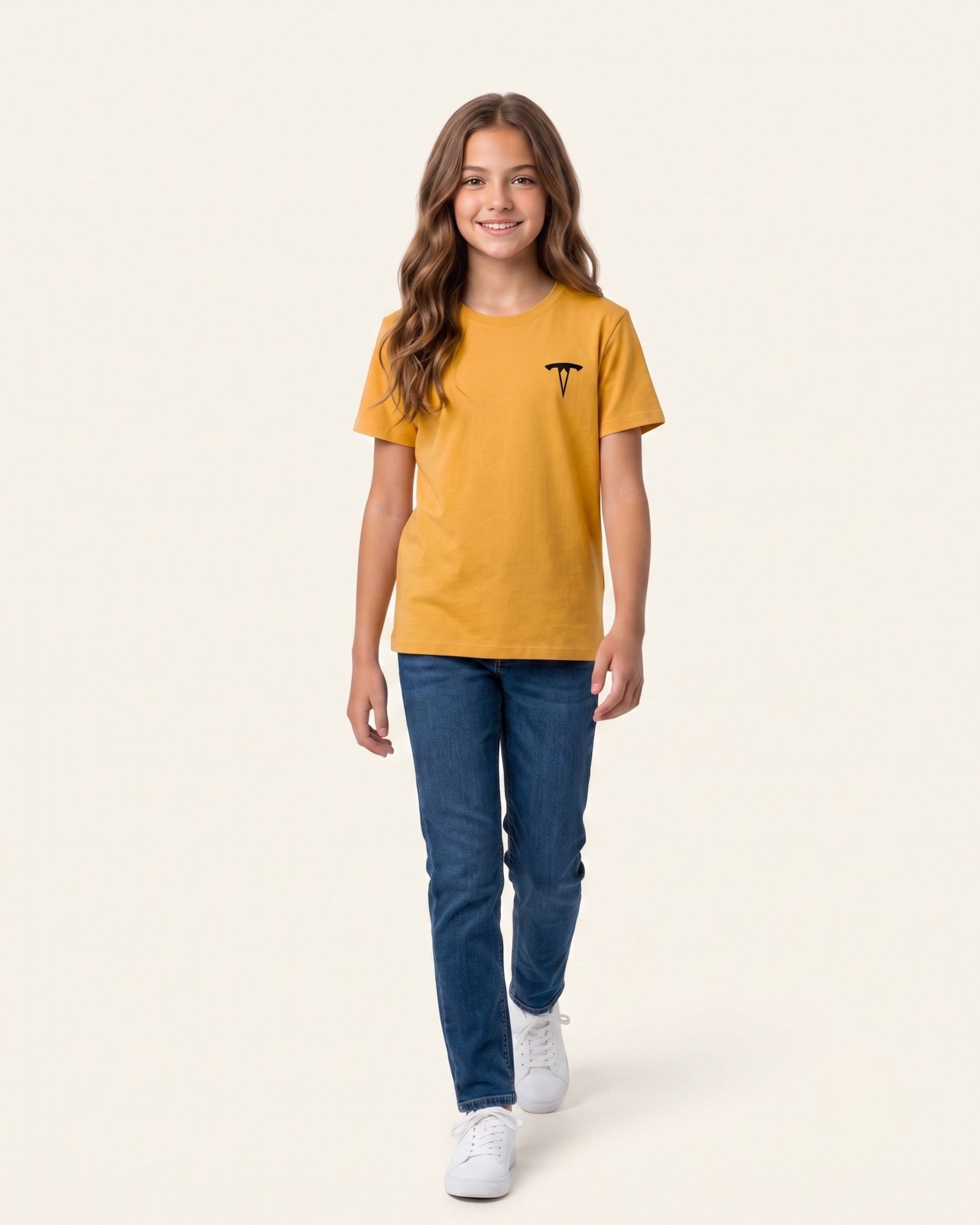 Girl wearing a mustard OUTCAST basic tee with jeans