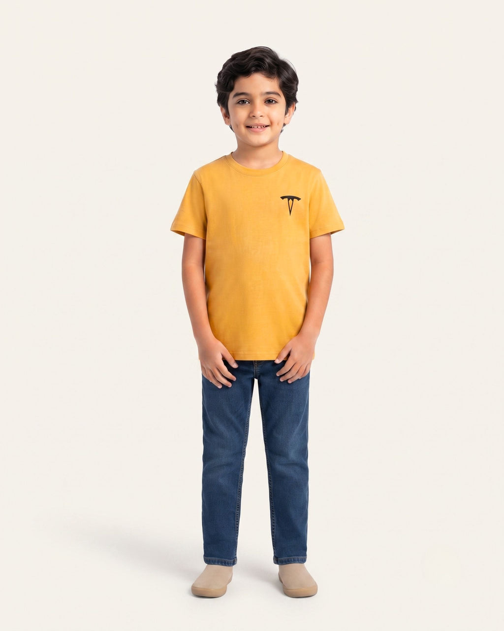 Boy wearing a mustard OUTCAST basic tee with jeans