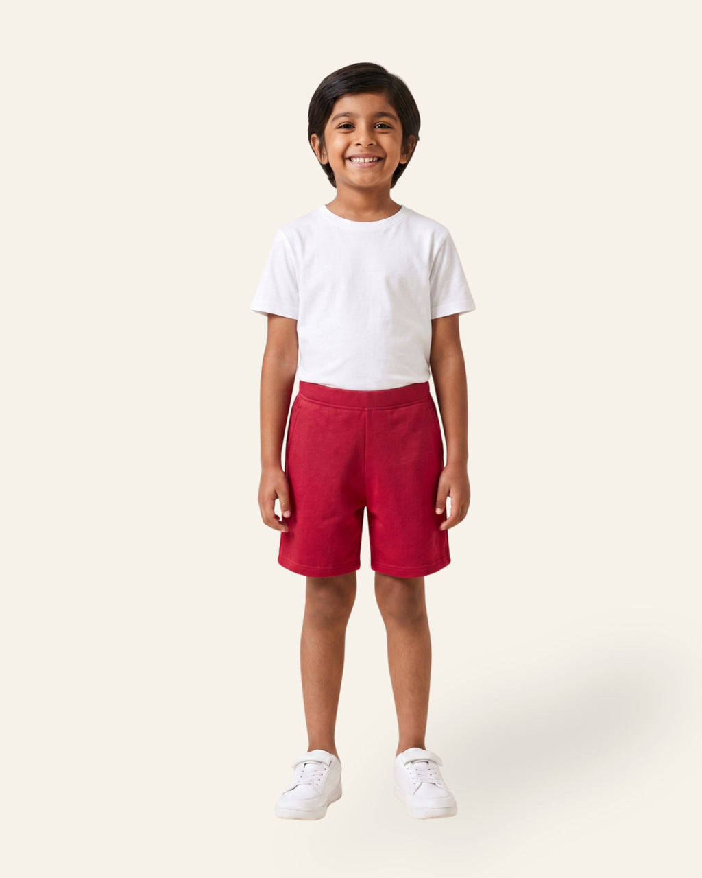 Boy wearing red OUTCAST kids shorts