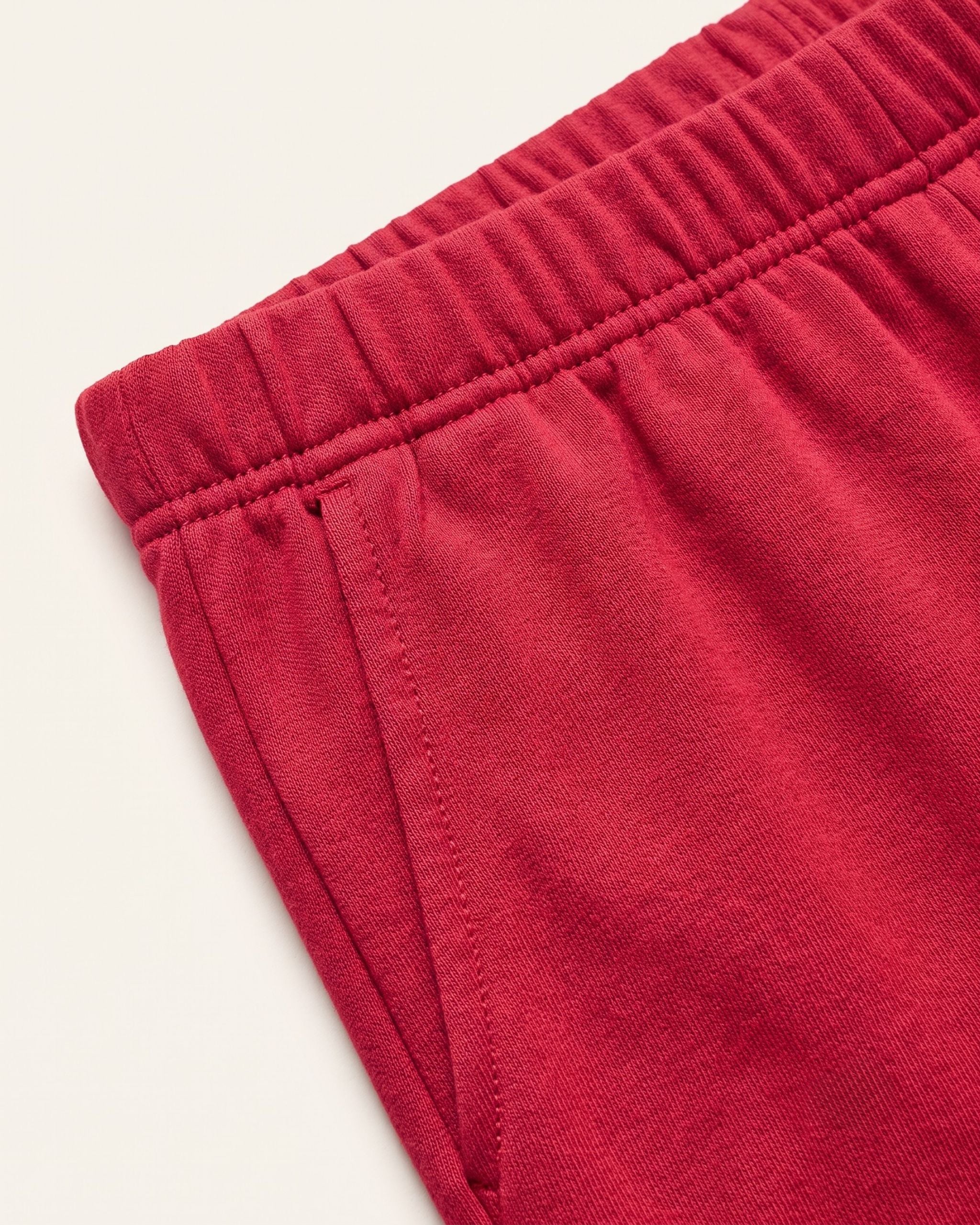 Close-up of the elastic waistband on red kids shorts