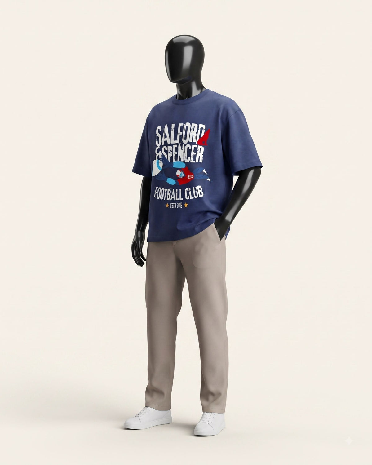 Man wearing a navy cotton tee with a retro varsity football club graphic on the front