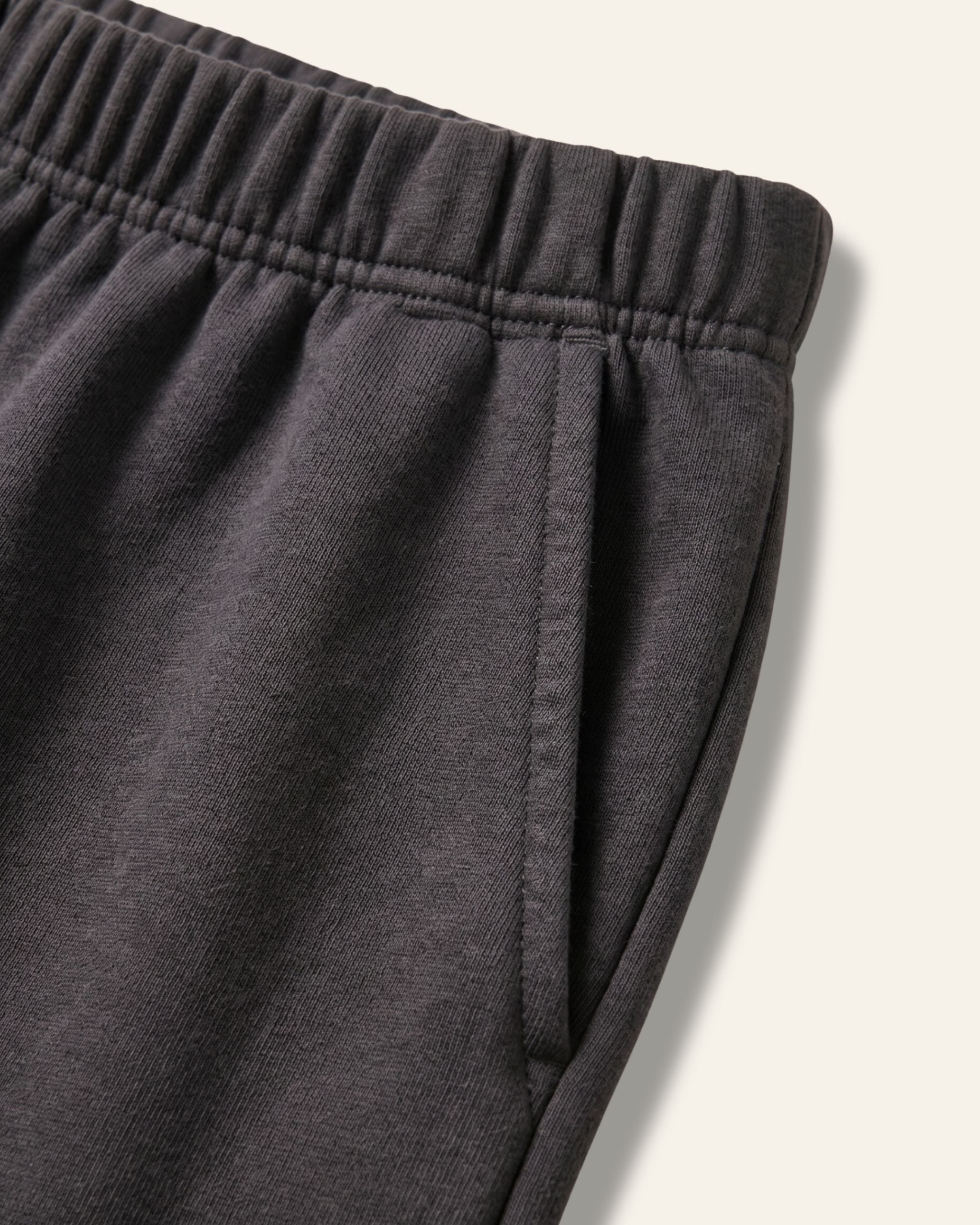 Close-up of the elastic waistband on black kids shorts