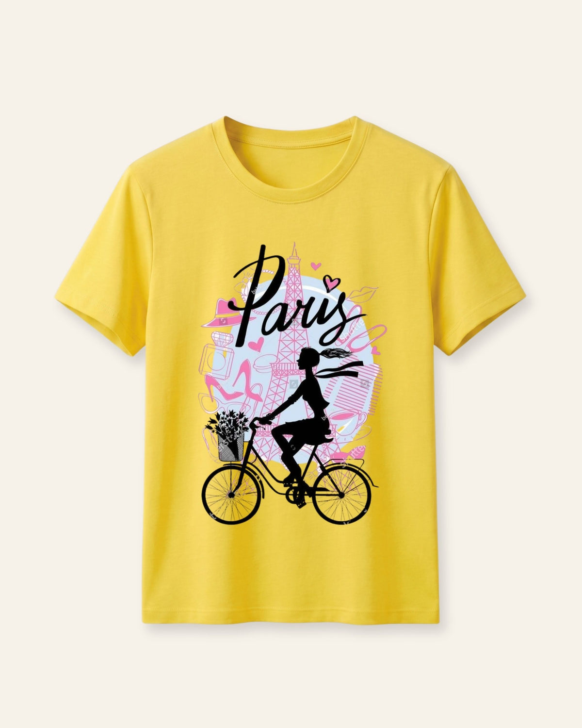 Yellow kids cotton tee with a girl cycling past a pink Eiffel Tower print