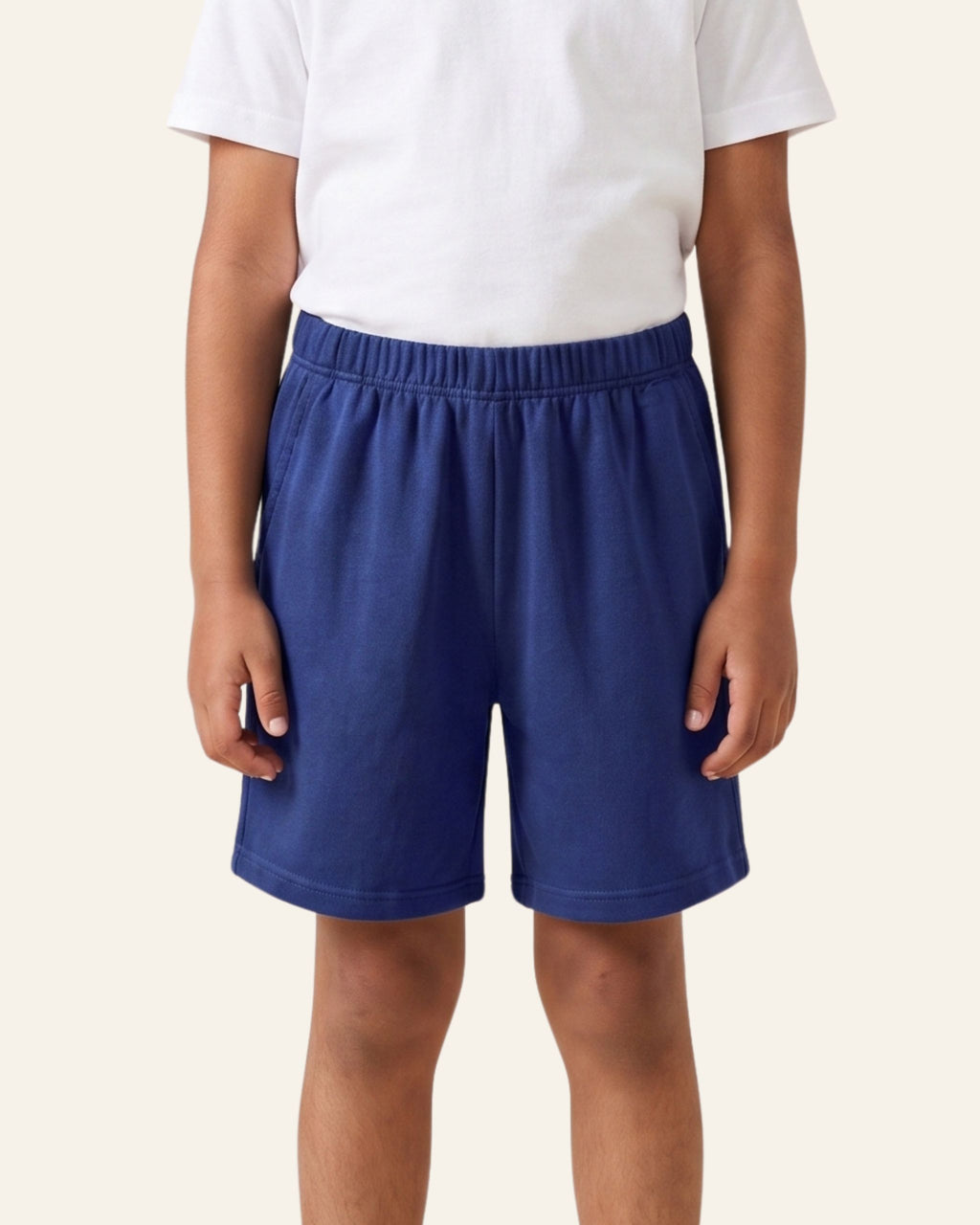 Boy wearing navy OUTCAST kids shorts