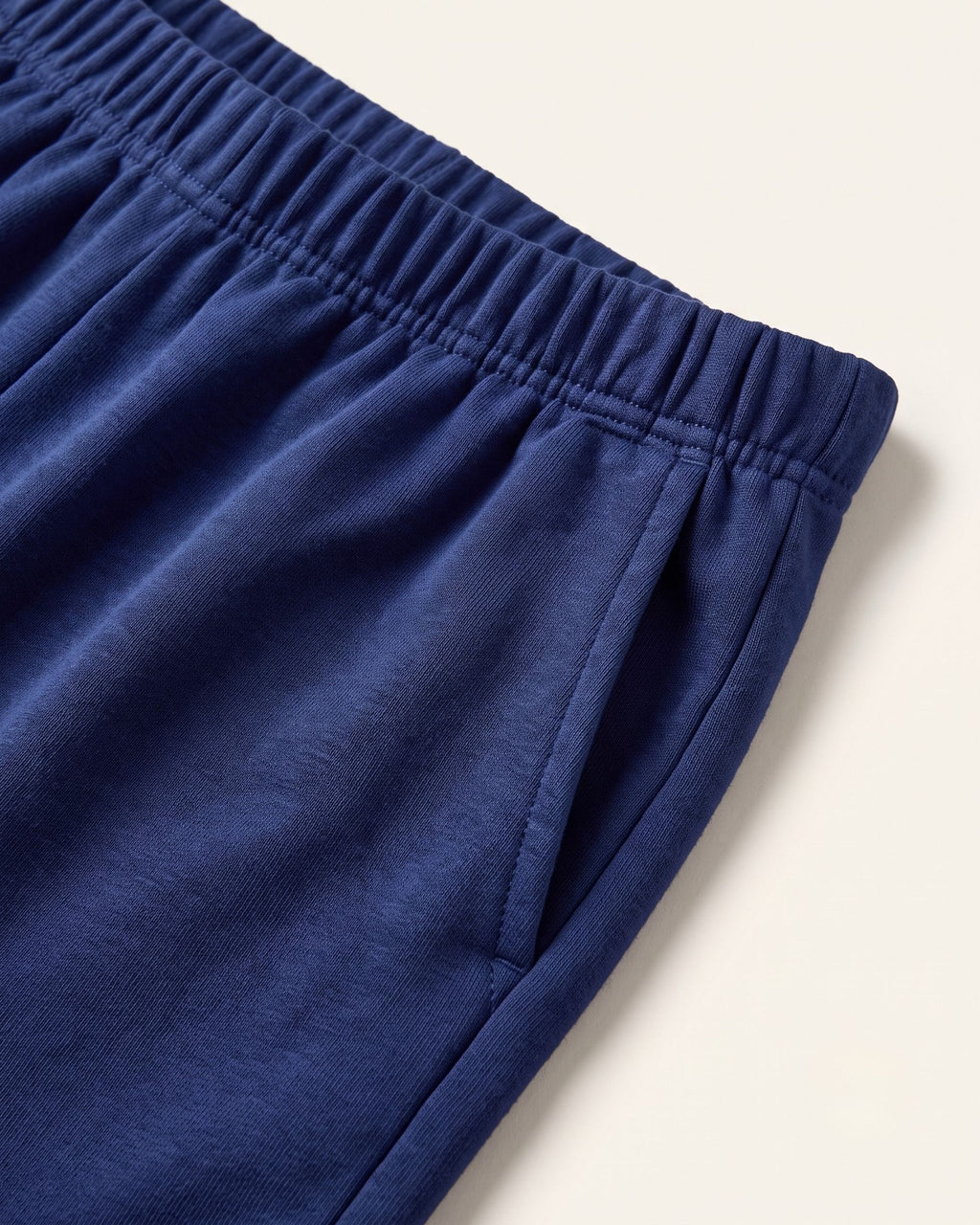 Close-up of the elastic waistband on navy kids shorts