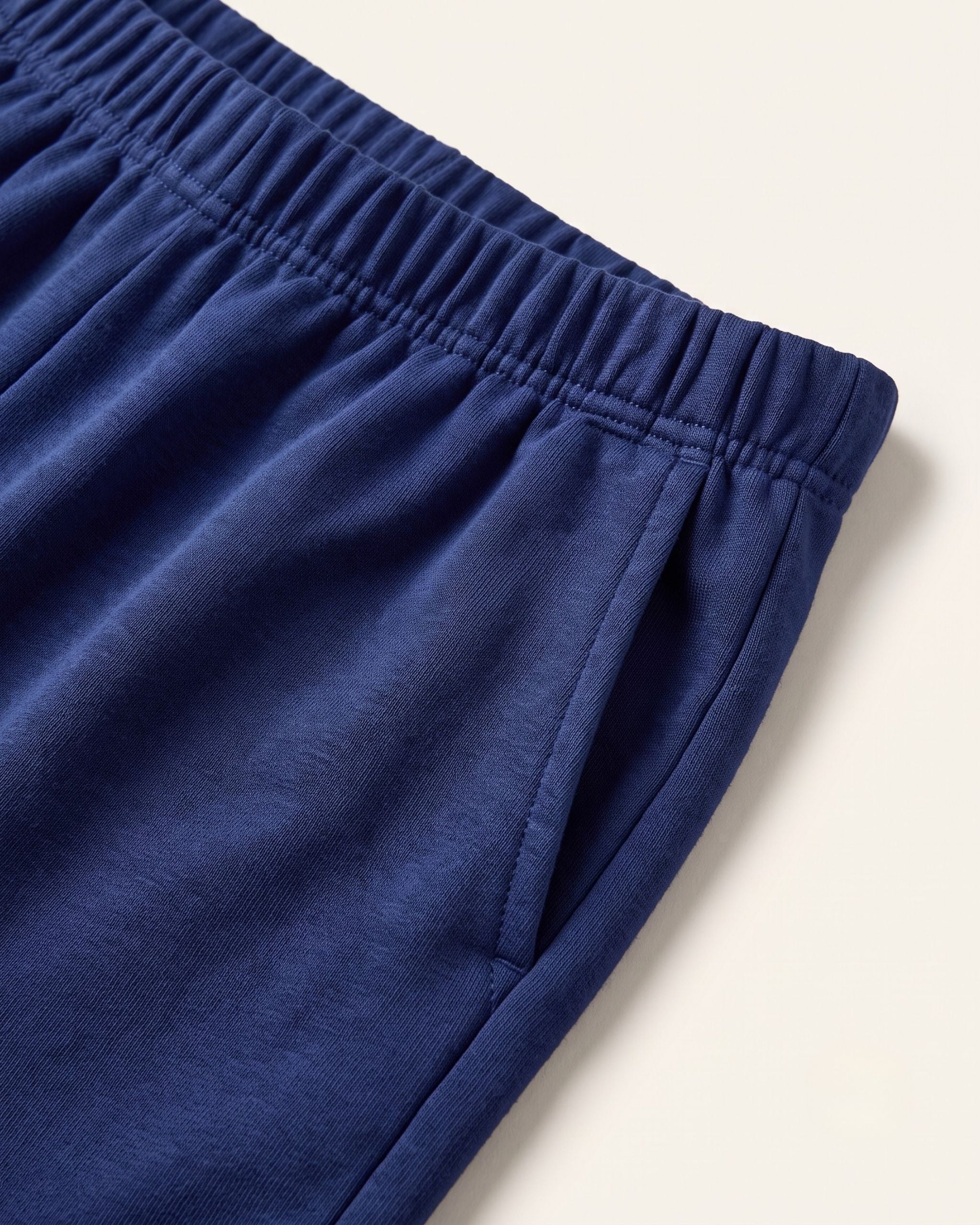 Close-up of the elastic waistband on navy kids shorts