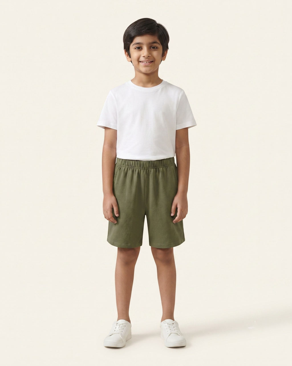 Boy wearing olive OUTCAST kids shorts