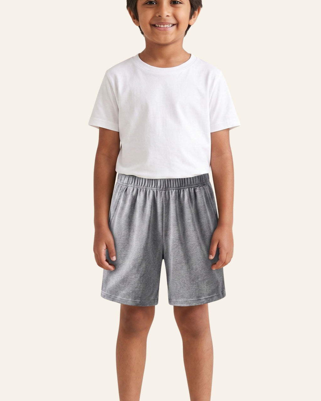 Boy wearing grey marl OUTCAST kids shorts
