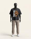 Man wearing a black cotton tee with a snarling tiger and tall TIGER wordmark print