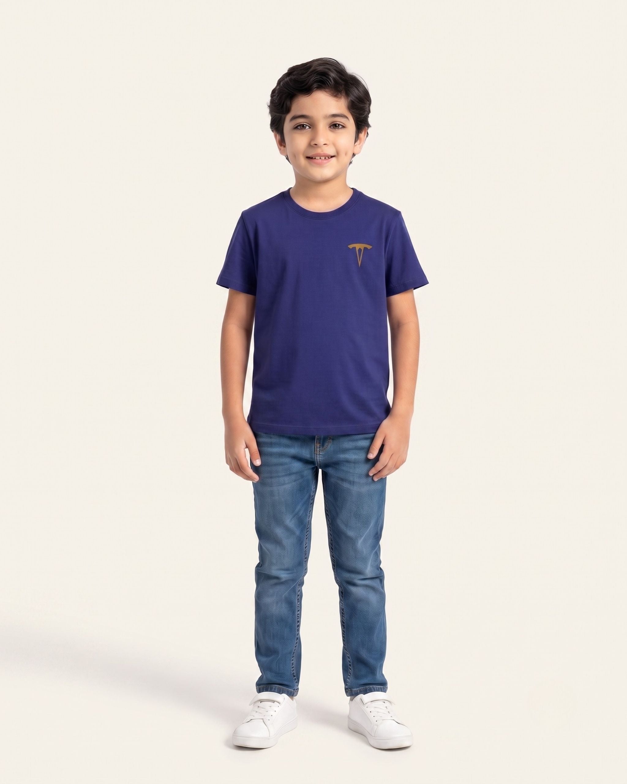 Boy wearing a navy OUTCAST basic tee with jeans