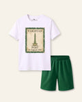 Kids white tee with a vintage postage stamp print and green shorts