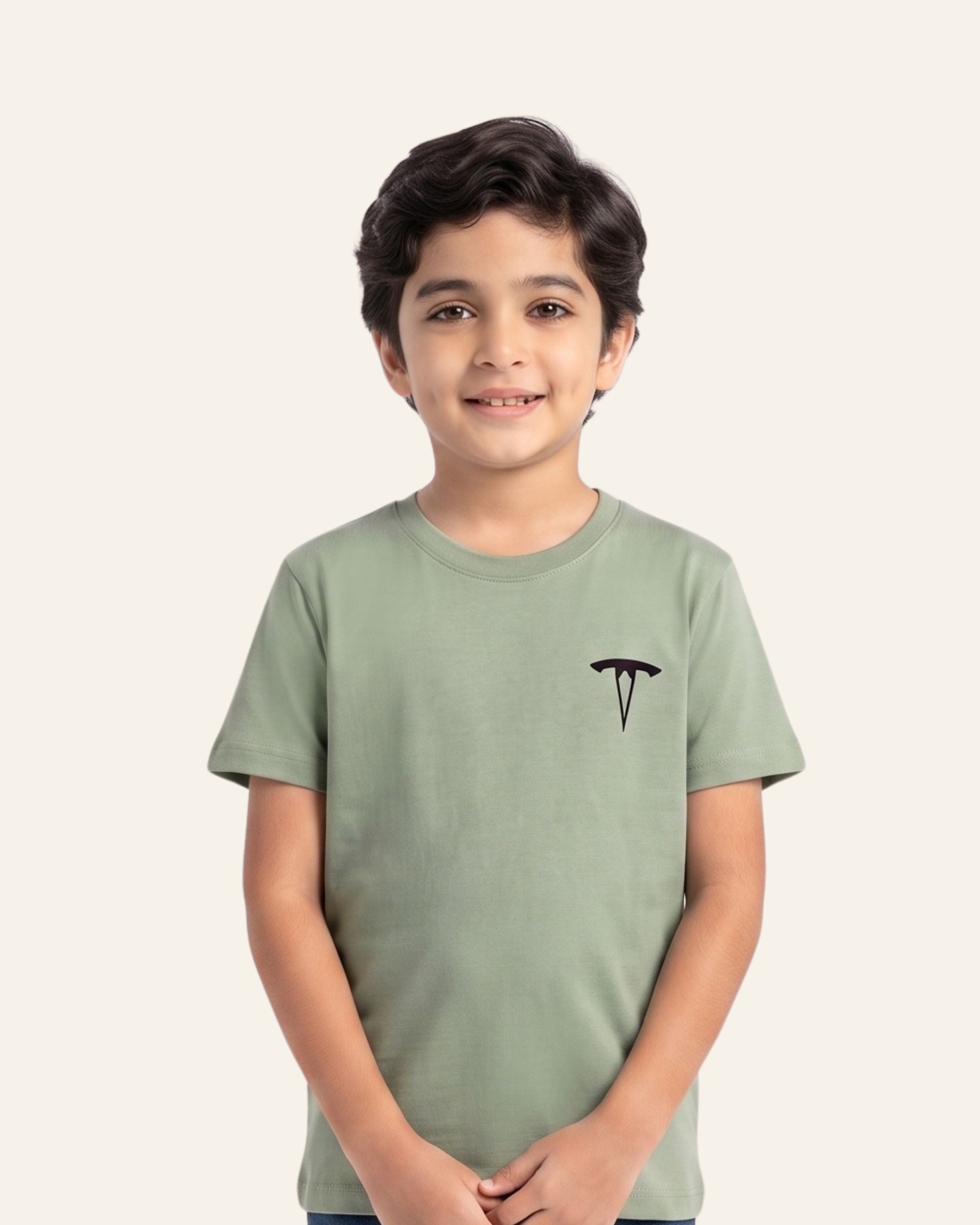 Boy wearing a sage OUTCAST basic tee