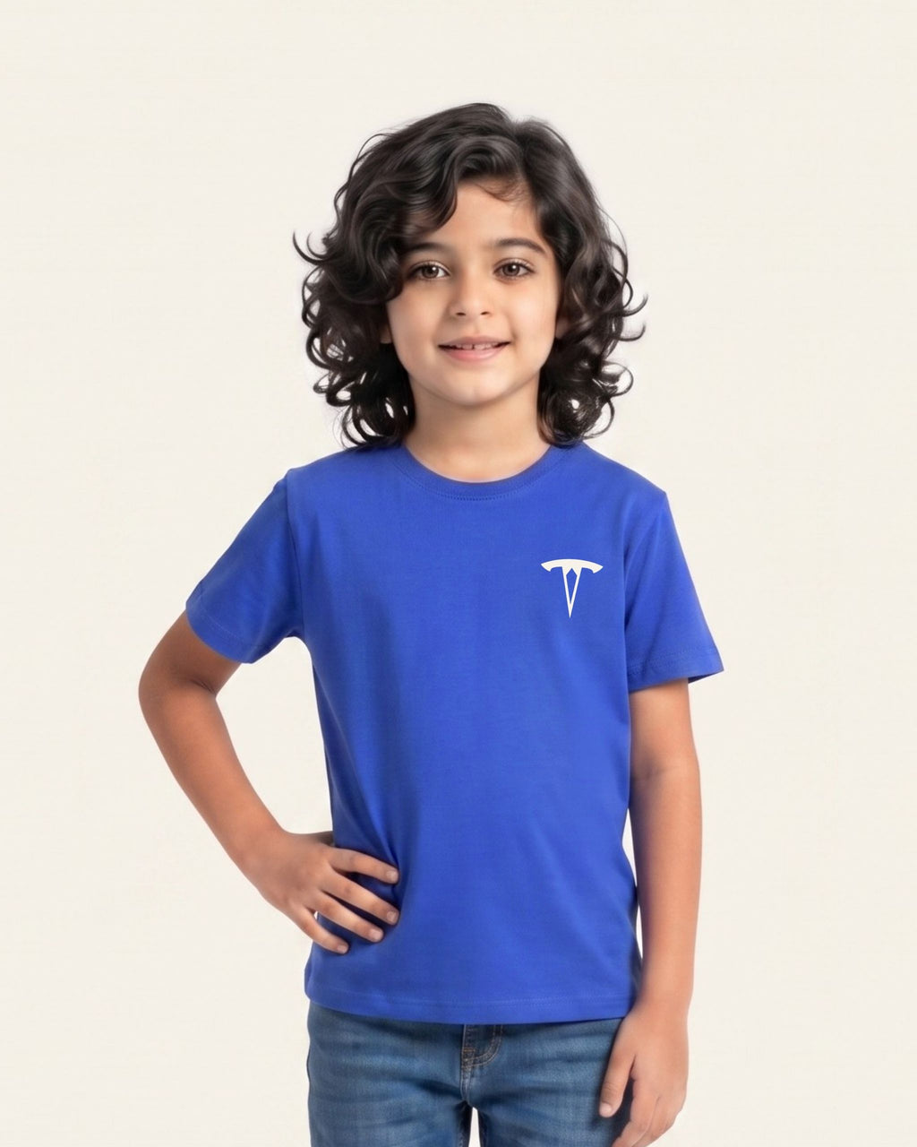 Boy wearing a royal blue OUTCAST basic tee with jeans