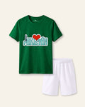 Kids green tee with I love Pakistan over a skyline and white shorts