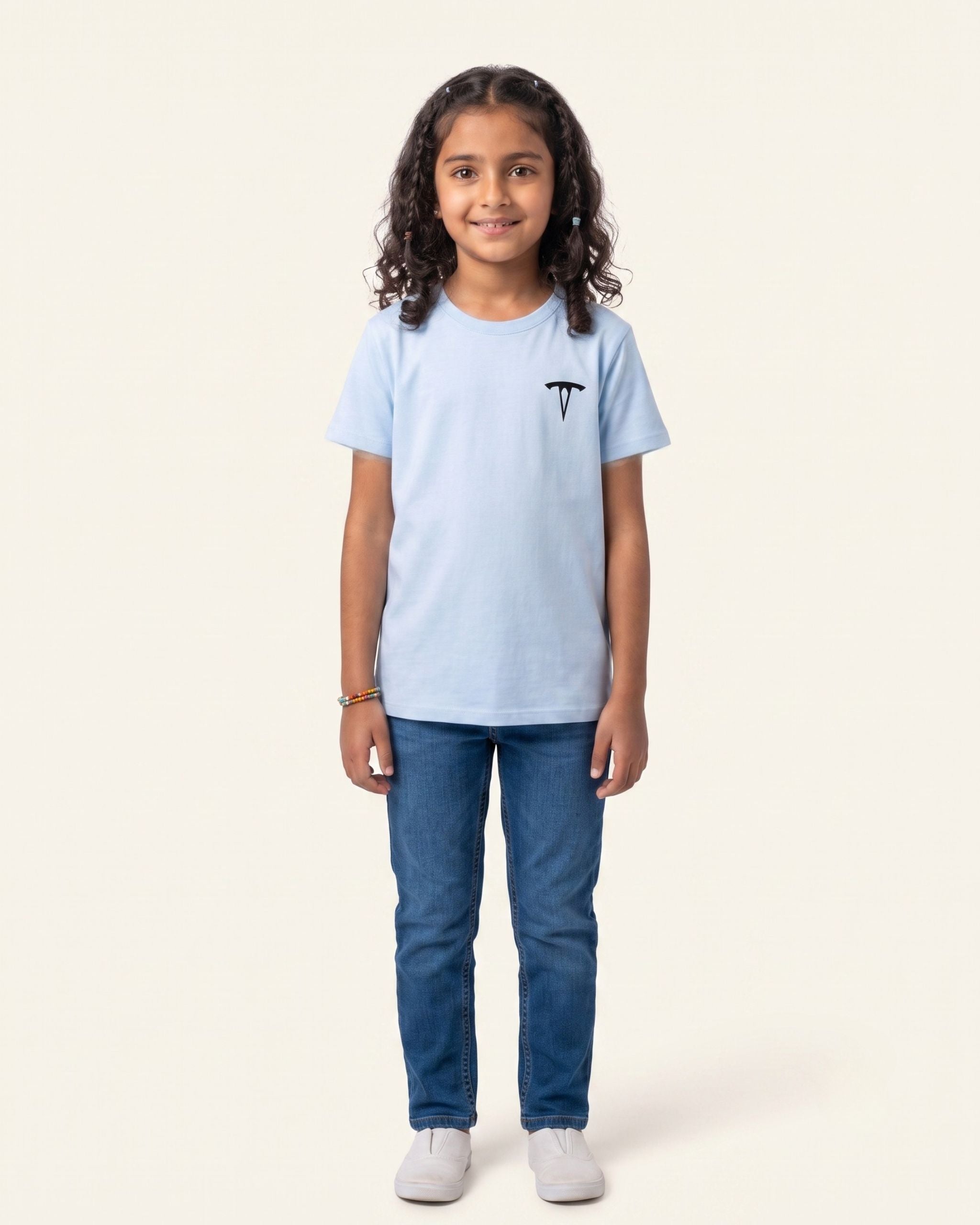 Girl wearing a sky blue OUTCAST basic tee, full length