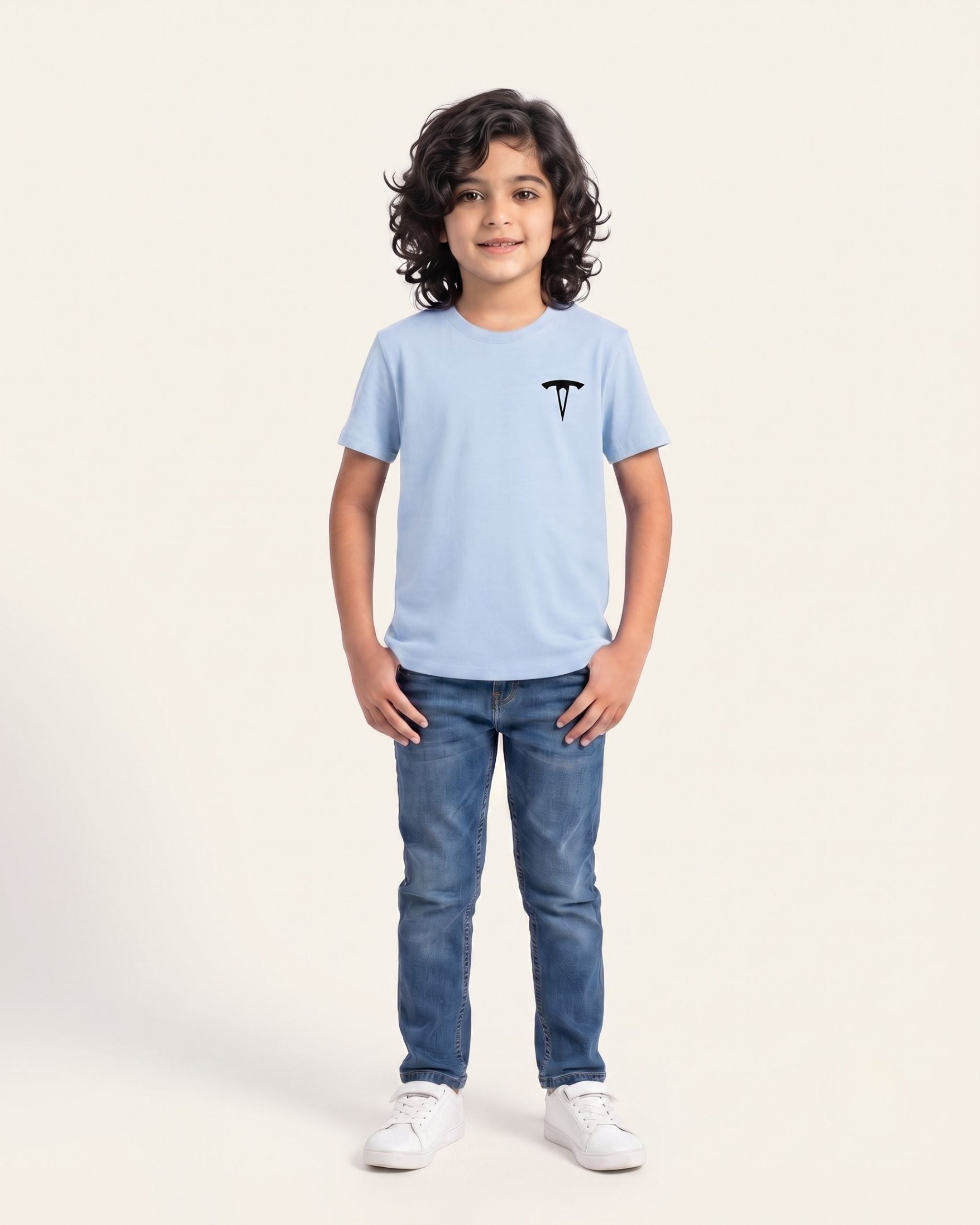 Boy wearing a sky blue OUTCAST basic tee with jeans