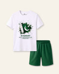 Kids white tee with a 14 August flag spray print and green shorts