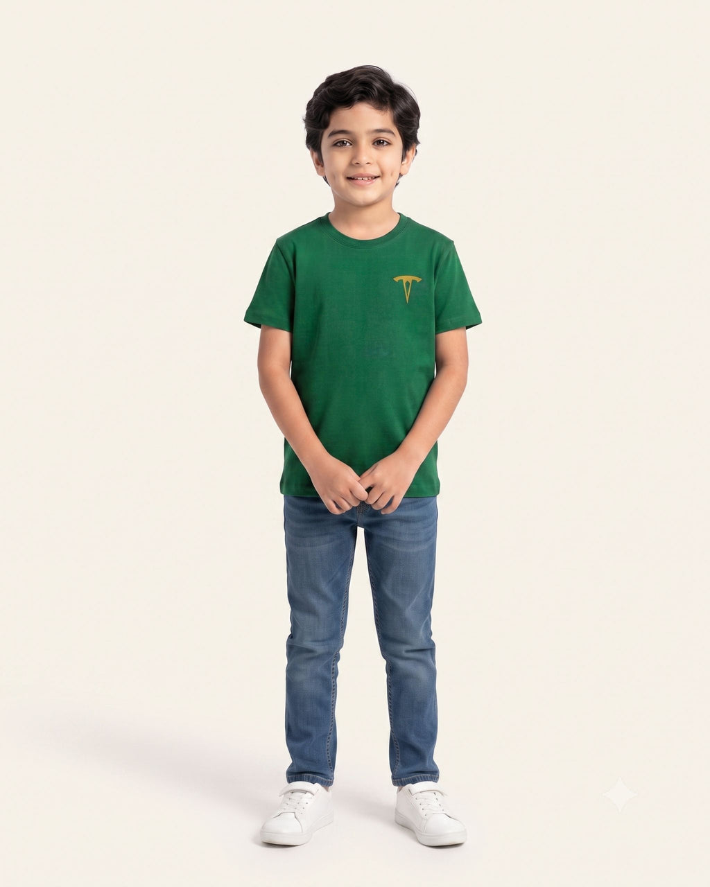 Boy wearing a green OUTCAST basic tee with jeans
