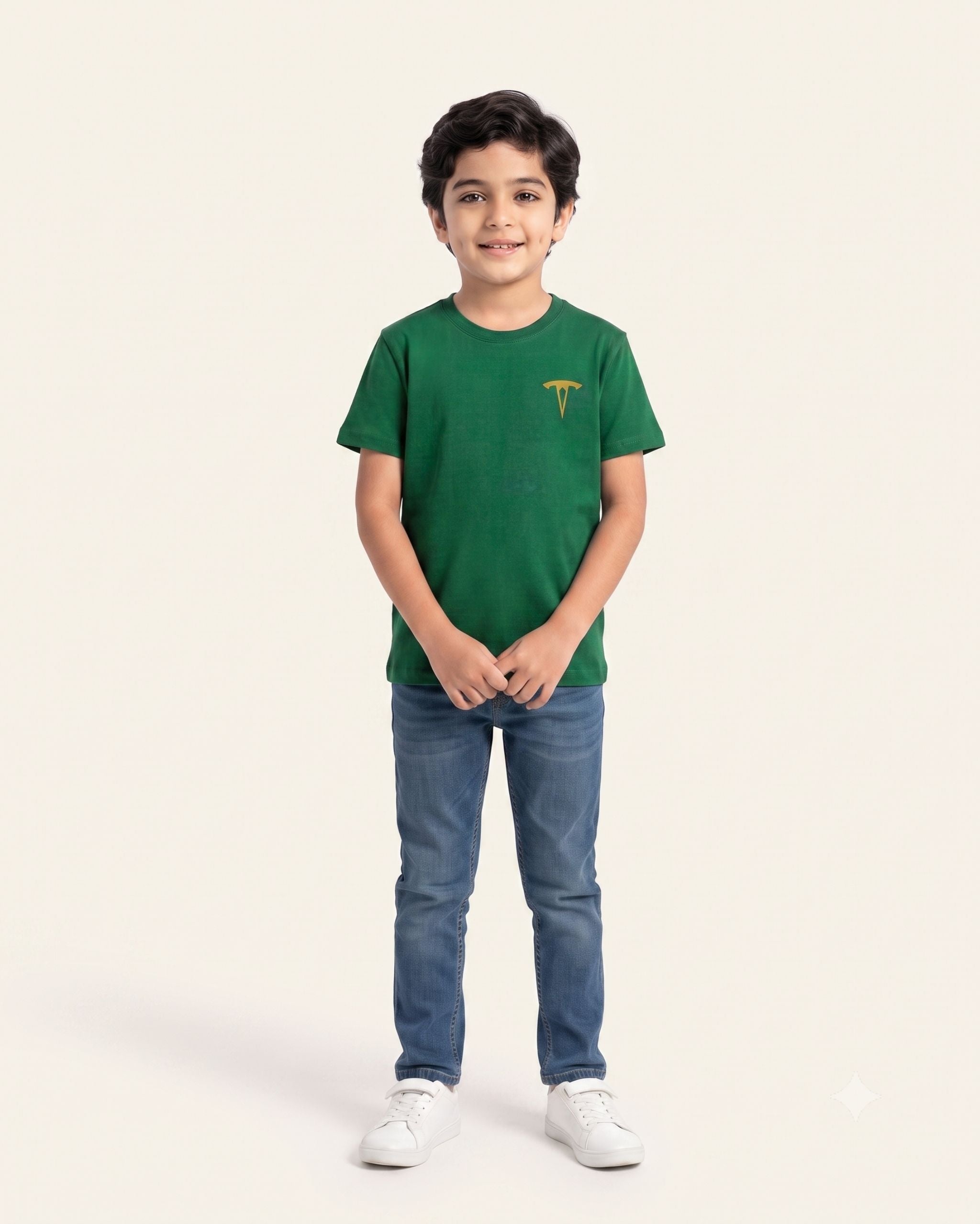 Boy wearing a green OUTCAST basic tee with jeans