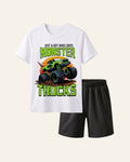 White kids tee with a monster trucks print and matching dark shorts