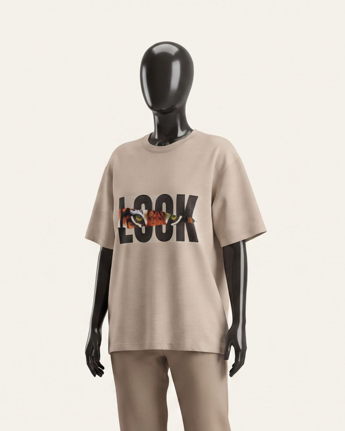 Women's sand cotton tee with bold LOOK tiger graphic, shown on a display form