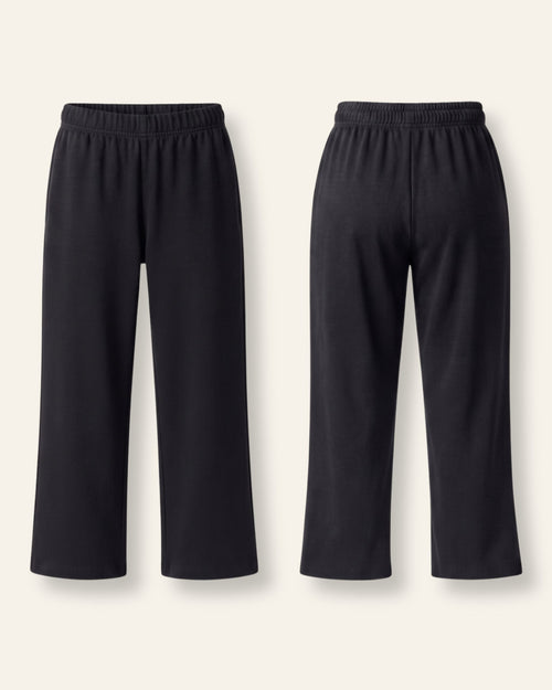 Kids black trousers with an elastic waist, flat front and back