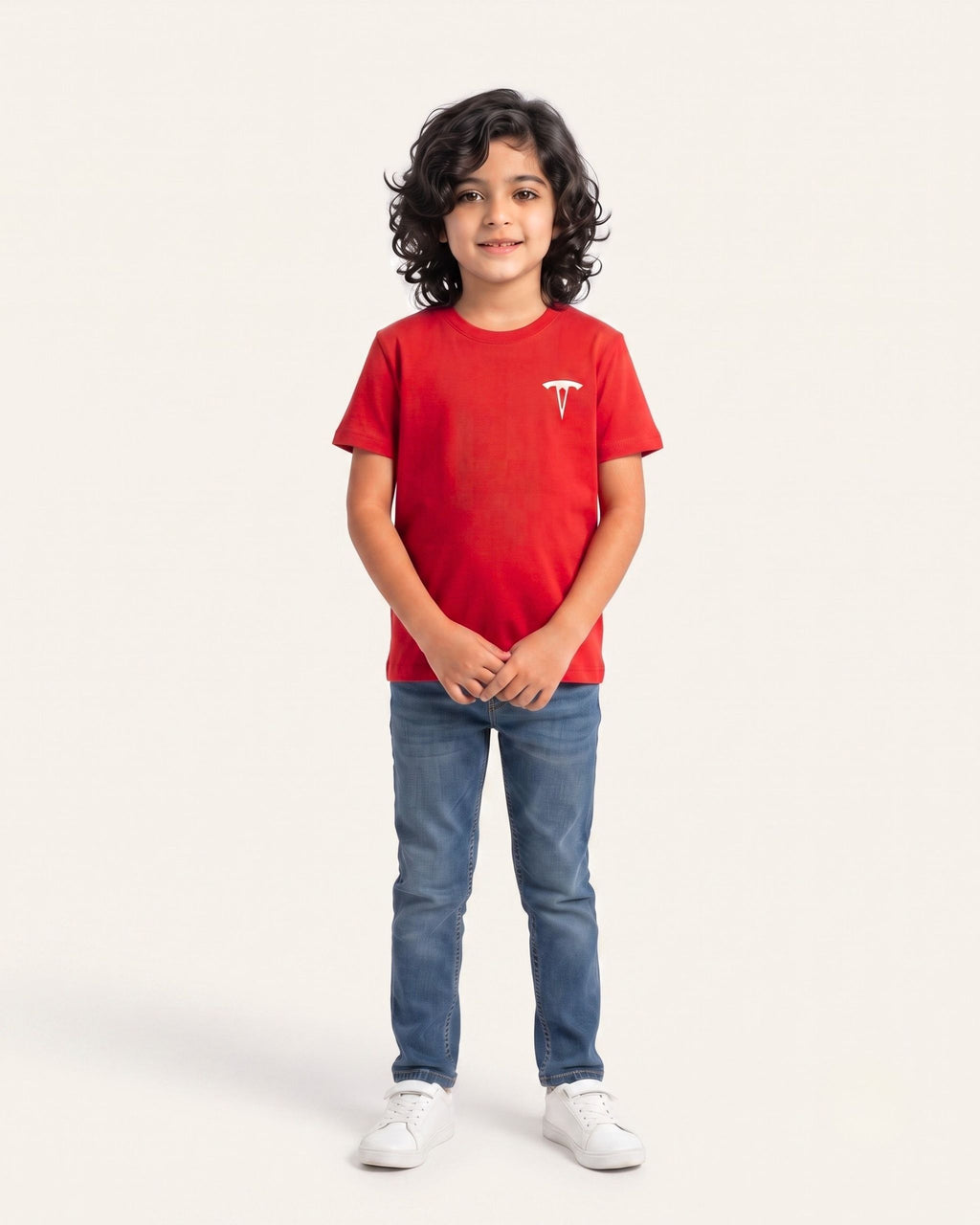 Boy wearing a red OUTCAST basic tee with jeans